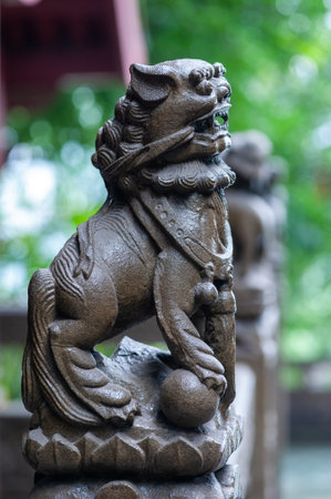 Lion stone statue in a buddhist templeの写真素材