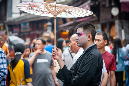 Man with chinese opera make-up in the streetのeditorial素材