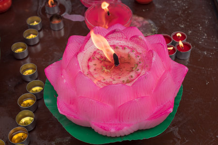 Lotus candle in a buddhist templeの写真素材