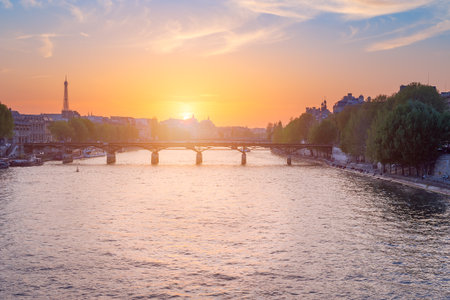 Paris skyline at sunset with river Seine in the foreground, Franceの写真素材