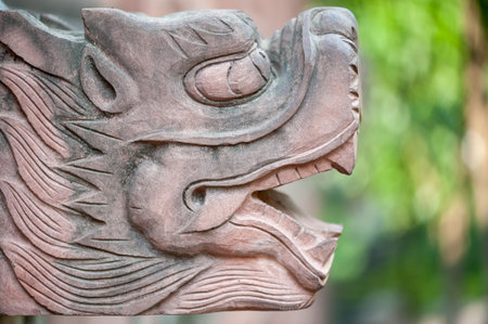 Stone dragon head scultpure close-up in a buddhist temple, Chinaの写真素材