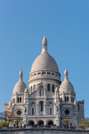 Paris, France - April 12, 2019 : The Basilica of the Sacre Coeur in the hill of Montmartre on a sunny dayのeditorial素材