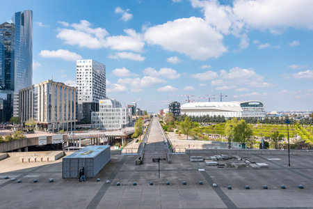 Paris, La Defense, France - April 14, 2019 : Skyscrapers of La Defense modern business and financial district in Paris with highrise buildings and la Defense Arena stadium in the backgroundのeditorial素材
