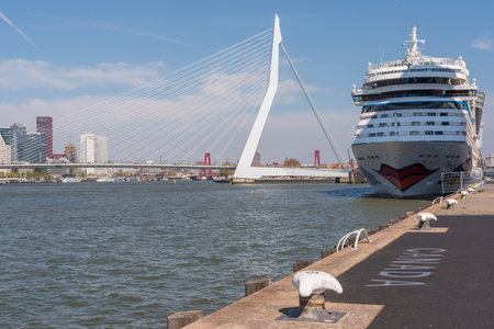 Rotterdam, Netherlands - April 18, 2019 : Aidamar cruise ship from the german AIDA cruises company stationning at the cruise terminal situated alongside the Nieuwe Maas river against a clear blue sky.のeditorial素材