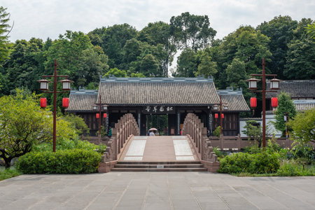 Chengdu, Sichuan province, China - Aug 17, 2019 : Stone bridge and traditional chinese building in HuanHuaXi park.のeditorial素材
