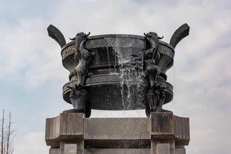 Chengdu, Sichuan province, China - Aug 17, 2019 : Fountain with a chinese quadripod in HuanHuaXi parkのeditorial素材