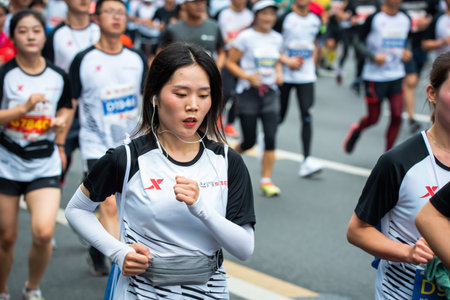 Chengdu, Sichuan province, China - Oct 27, 2019 : Young woman running at the Chengdu marathon