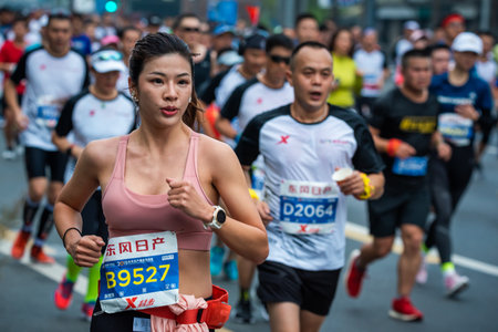 Chengdu, Sichuan province, China - Oct 27, 2019 : Young woman running at the Chengdu marathonのeditorial素材