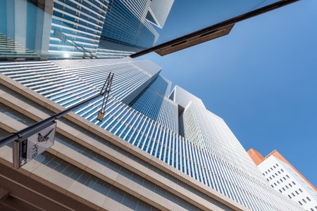 Rotterdam, Netherlands - April 18, 2019 : De Rotterdam skyscraper low angle view reflections in a glass building in Wilhelminapier district.のeditorial素材