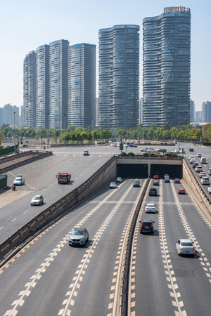 Chengdu, Sichuan province, China - March 31, 2020 : Highway traffic with skyscrapers in the background on a sunny day in South Chengduのeditorial素材