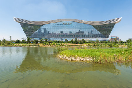 Chengdu, Sichuan province, China - Aug 26, 2020 : New Century Global Center building reflecting in a lake on a sunny day with clear blue skyのeditorial素材