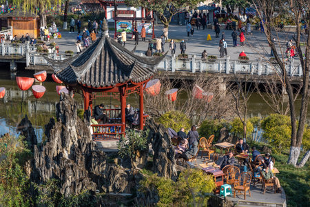 Chengdu, Sichuan province, China - Jan 17, 2021 : People enjoying a sunny day and drinking tea in Culture park.のeditorial素材