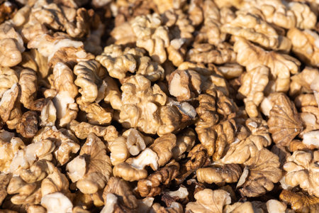 Heap of open walnuts on a market stall in Chengdu, Sichuan province, Chinaの写真素材
