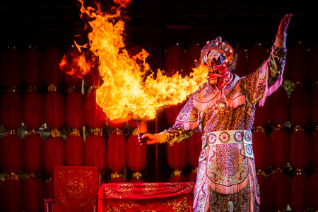 Peoples park, Chengdu, Sichuan province, China - March 1st, 2022 : Sichuan opera firespitter in...
