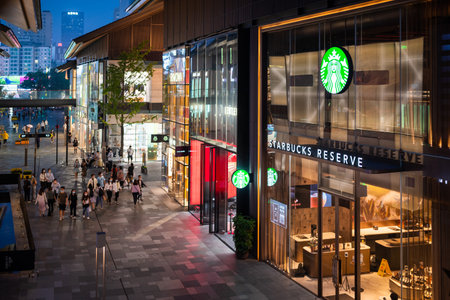 Chengdu, Sichuan province, China - Sept 22, 2022: Starbucks coffee shop facade at night in Taikooli commercial area, downtown Chengduのeditorial素材