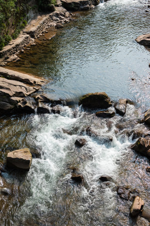 Water spring flowing in the mountain close-up view