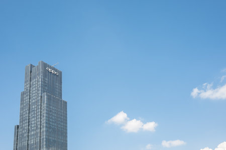 Chengdu, Sichuan province, China - Aug 13, 2023 : Oppo tower against blue sky.のeditorial素材