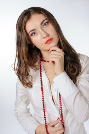 Sexy Woman with Red Bead wearing a white Shirtの写真素材