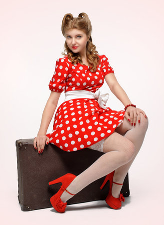 pretty pinup model in a red and white polkadot dressの写真素材