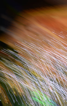 Colourful background on dark, abstract movement of the lights.