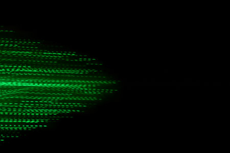 Modern art. Long exposure LED lights blur black backgroundの写真素材