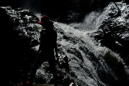 Standing woman on Waterfall background. Black and white. Element of design.