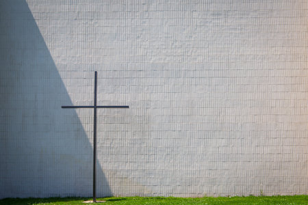 Cross of Jesus in front of a wallの写真素材