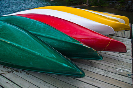 Kayaks lying on the Pier on the banks of Lake Moraineの写真素材