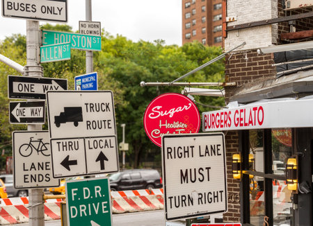 Many signs at a street corner in New York Cityのeditorial素材