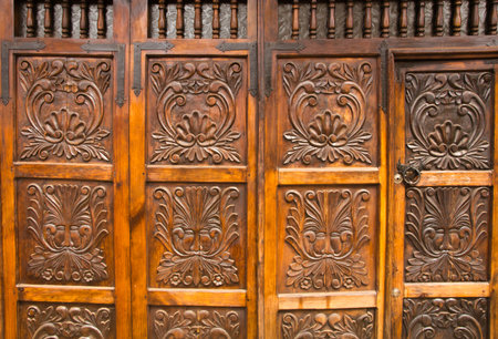 Carved wooden door of an old Mexican houseの写真素材