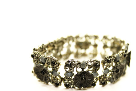 Decorative black flower bracelet isolated in white backgroundの写真素材
