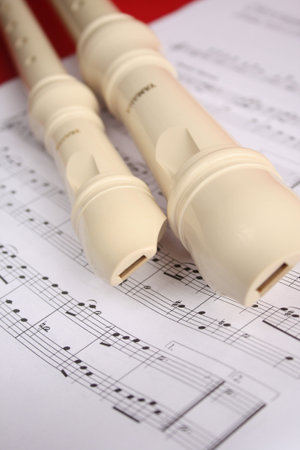 Two flutes on a music sheet.の写真素材