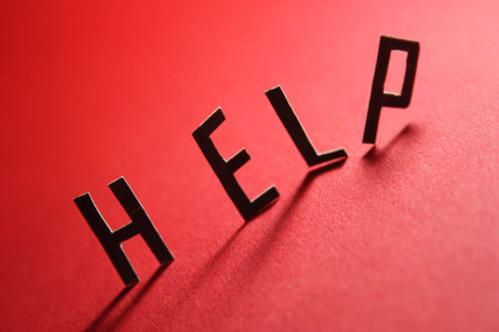 The word help on a red background.の写真素材