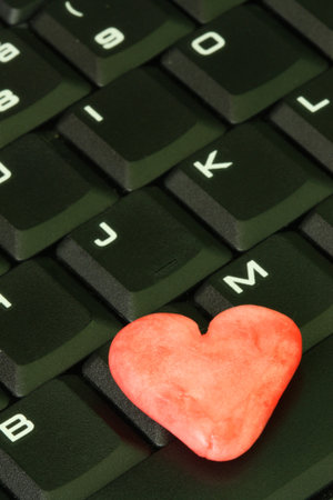 Red heart on the computer keyboard.の写真素材