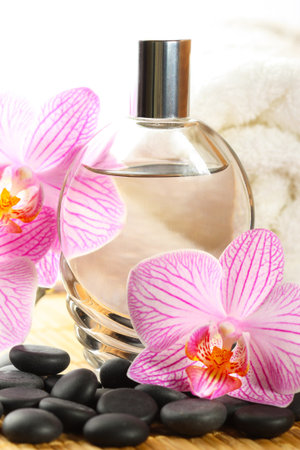 Perfume bottle, orchid flower and white towel の写真素材