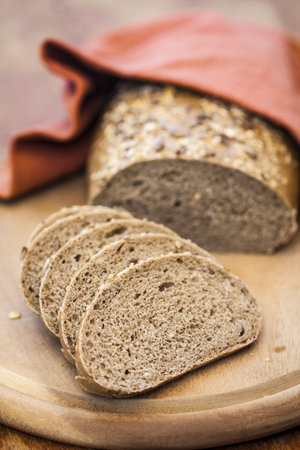 Slice of wholemeal bread and loaf の写真素材