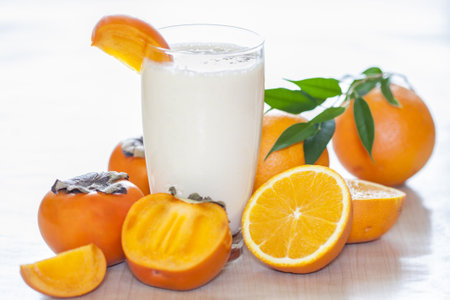 Milk shake with fruit -  orange and kaki の写真素材