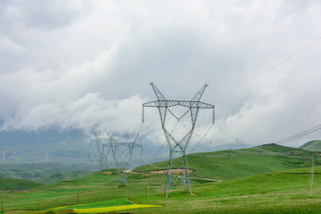 The power facilities on the Qinghai Tibet Plateau present a beautiful picture of the white clouds,...
