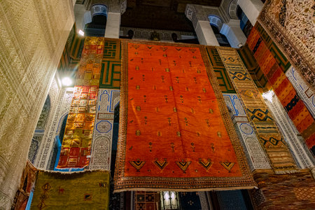 Rugs hanging from every available space deep in the Fes Medina in Morocco.の写真素材