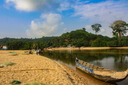 Fishing boat on the shore of the lake in Goa, Indiaの写真素材
