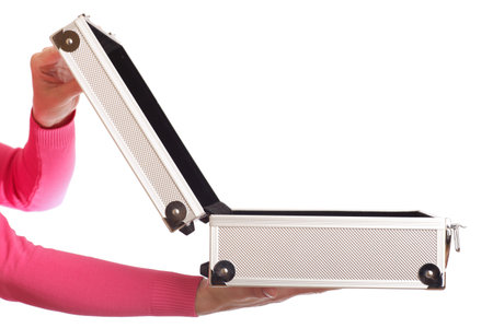 opened silver case in woman hand - isolated on whiteの写真素材