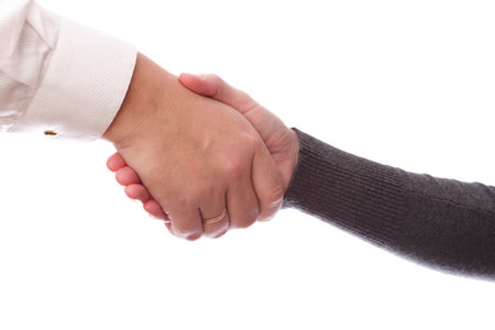 Handshake of business partners, men and women. Isolated on white background の写真素材