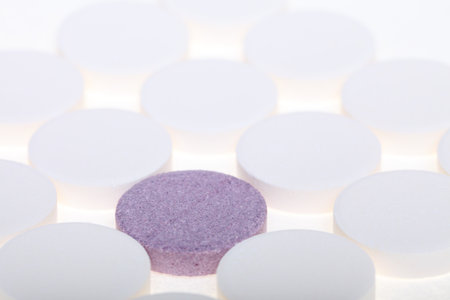 white big pills background - one pill stand out othersの写真素材