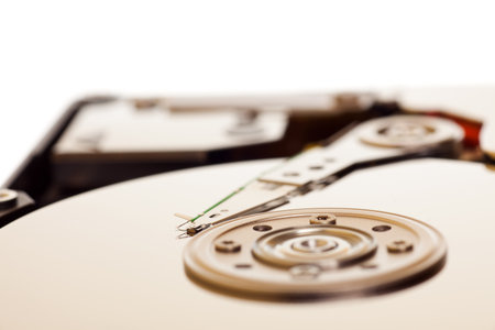 Close-up inside view of hard disk isolated on white background 