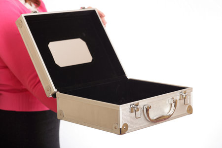 opened silver case in woman hand - isolated on whiteの写真素材