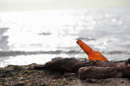 bottle on beach sea and skyの写真素材
