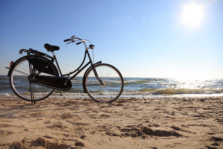 black bicycle at beach and seaの写真素材