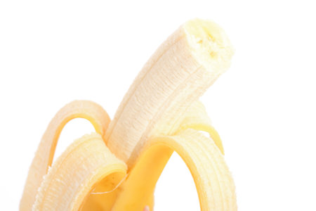 yellow banana isolated on white background の写真素材