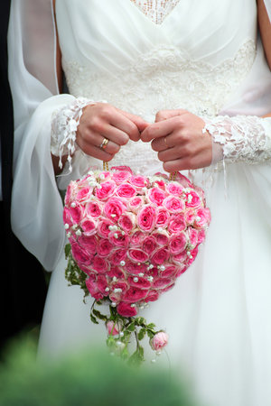 wedding bunch in woman hand outdoorの写真素材