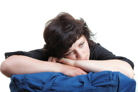 woman tired in black and blue shoulder bag isolated on whiteの写真素材